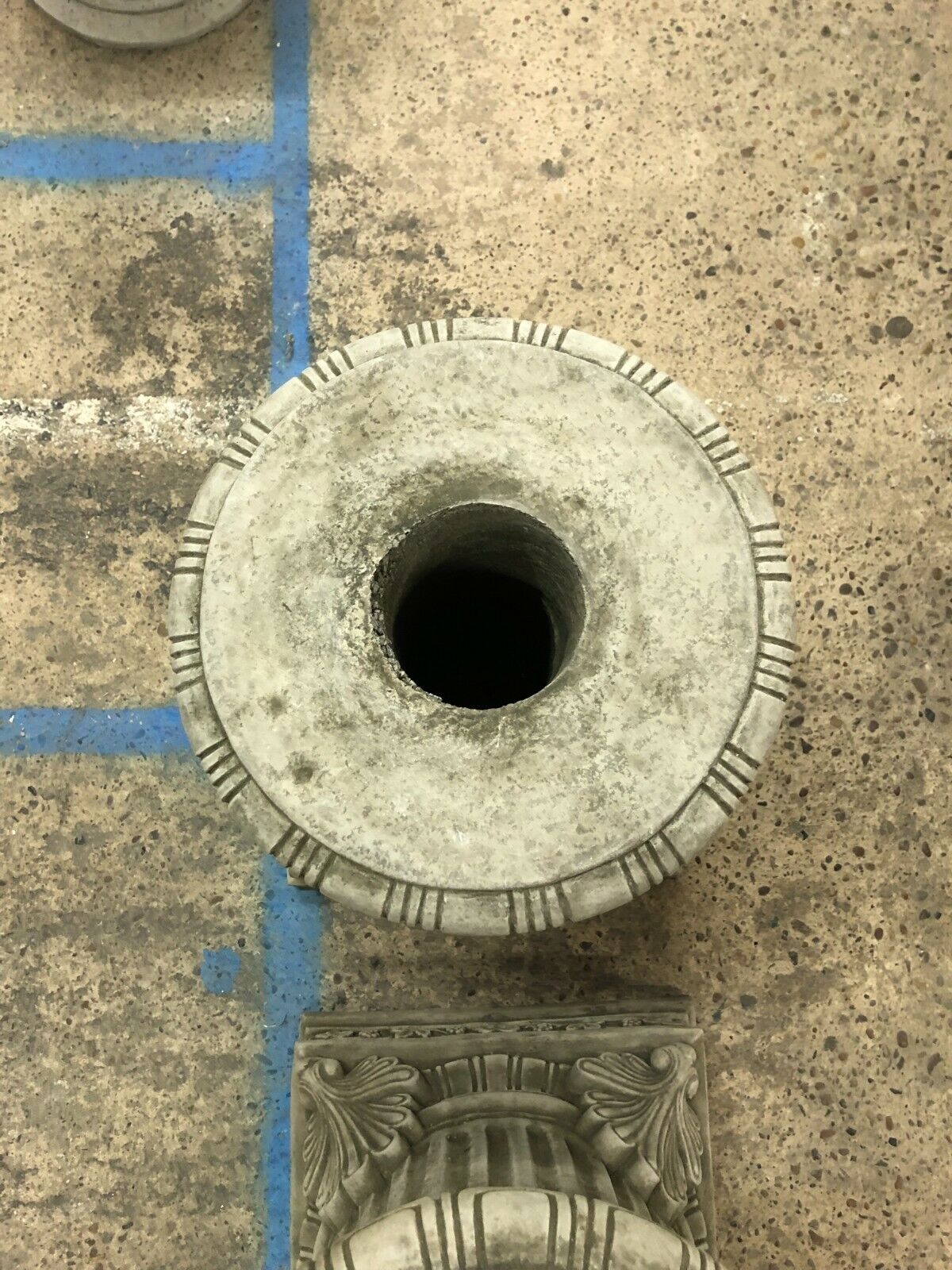 Overhead view of a round-topped limestone plinth with a central mounting hole, part of a classical garden decor collection.