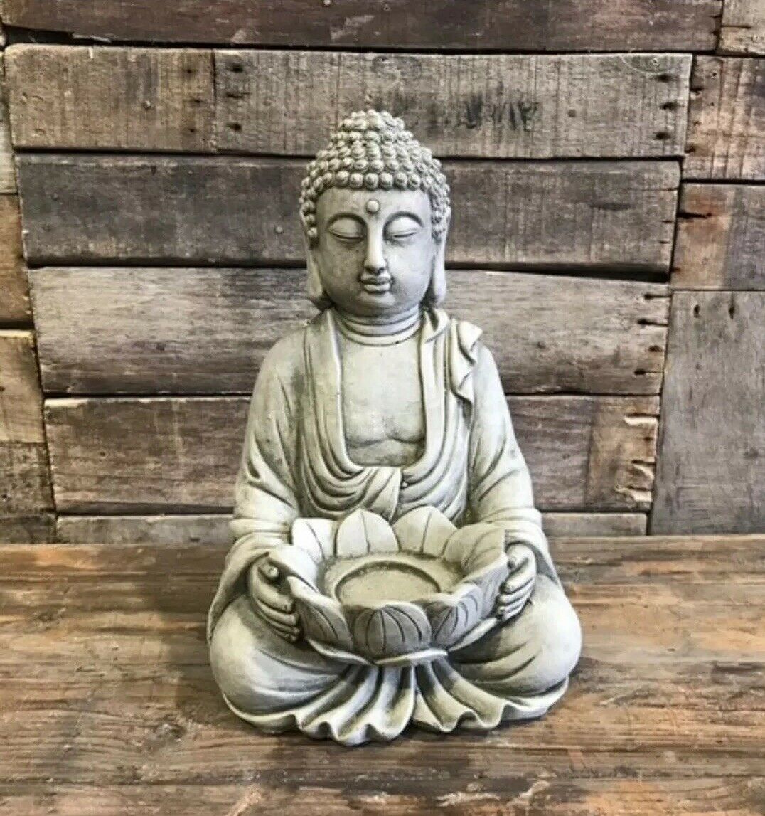 Buddha Garden Ornament with Stone Lotus Holder features a serene limestone Buddha statue holding a lotus tealight holder, ideal for outdoor decor.