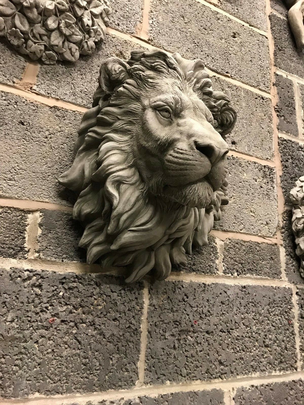 Three-quarter view of Stone King Lion Wall Plaque showcasing detailed mane and sturdy build, ideal for enhancing garden or patio aesthetics.