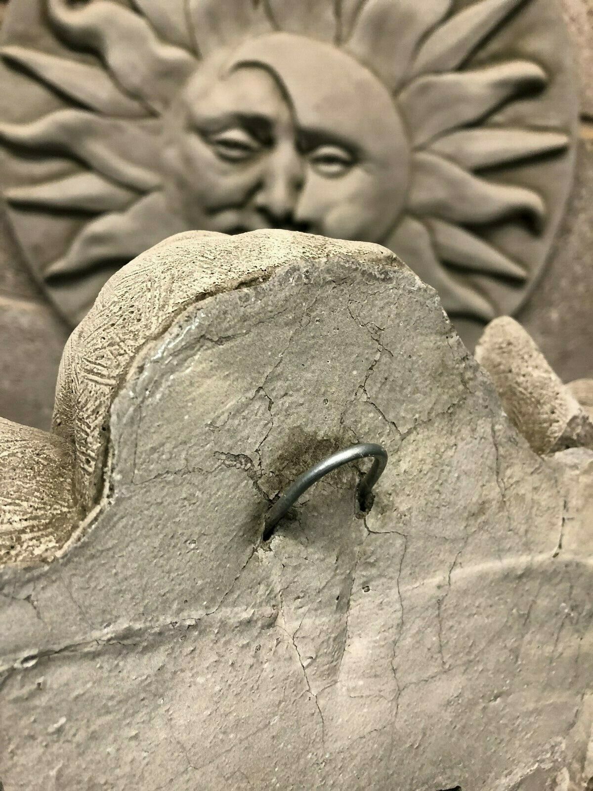 Back of Stone Welcome Dog Garden Plaque showing metal hanging hook and textured stone finish, suitable for secure wall mounting outdoors.