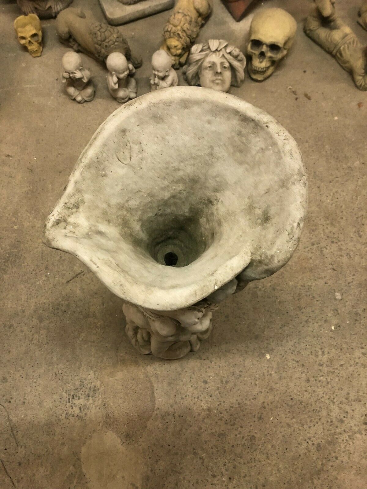 Angled top-down view of antique finish Stone Garden Planter Lady Statue, highlighting sculpted stone texture and wide planting cavity.