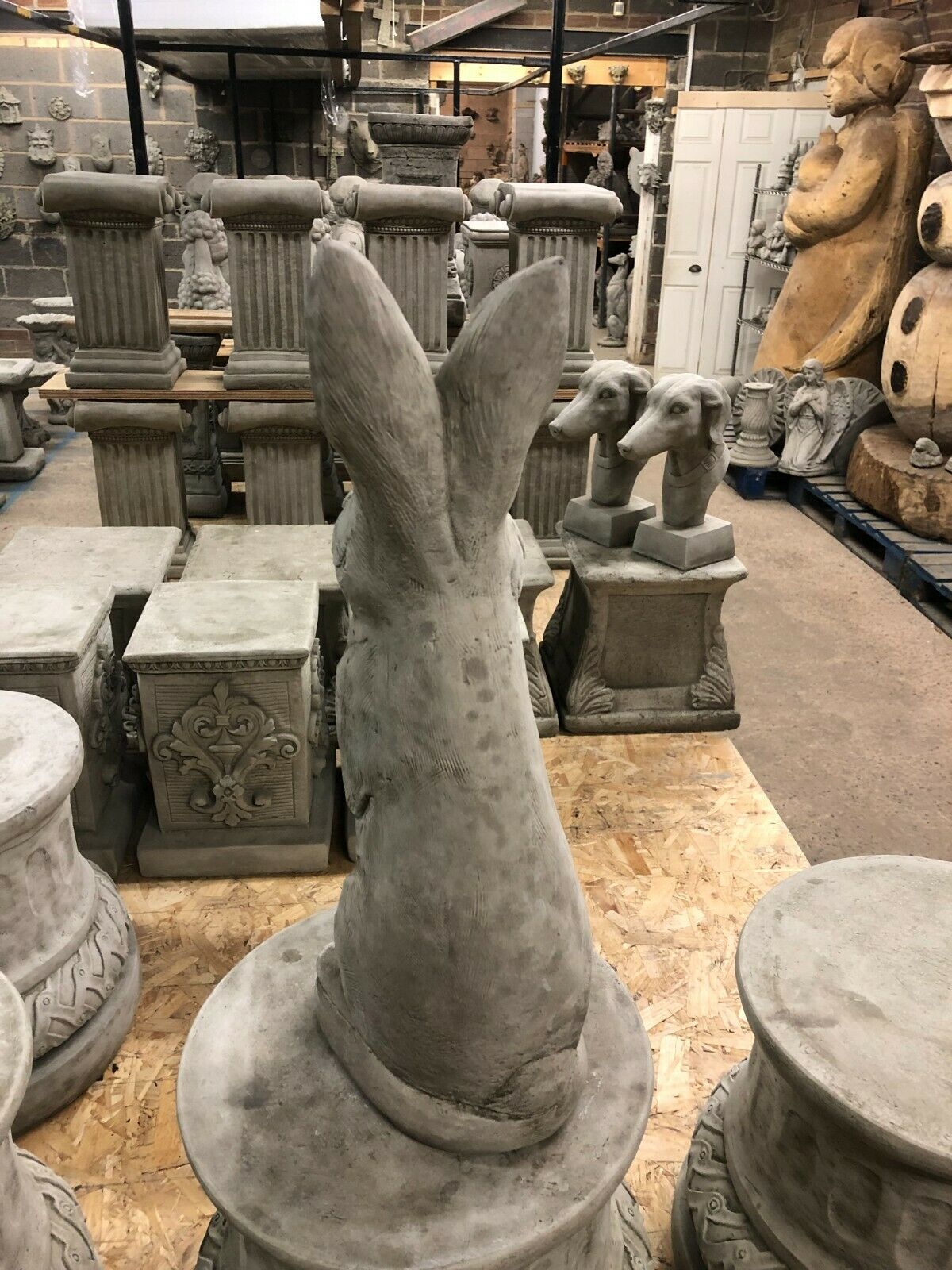 Rear view of Solid Bunny Ornament - Stone Rabbit Garden statue, showcasing textured stone finish and sturdy base for stable garden placement.