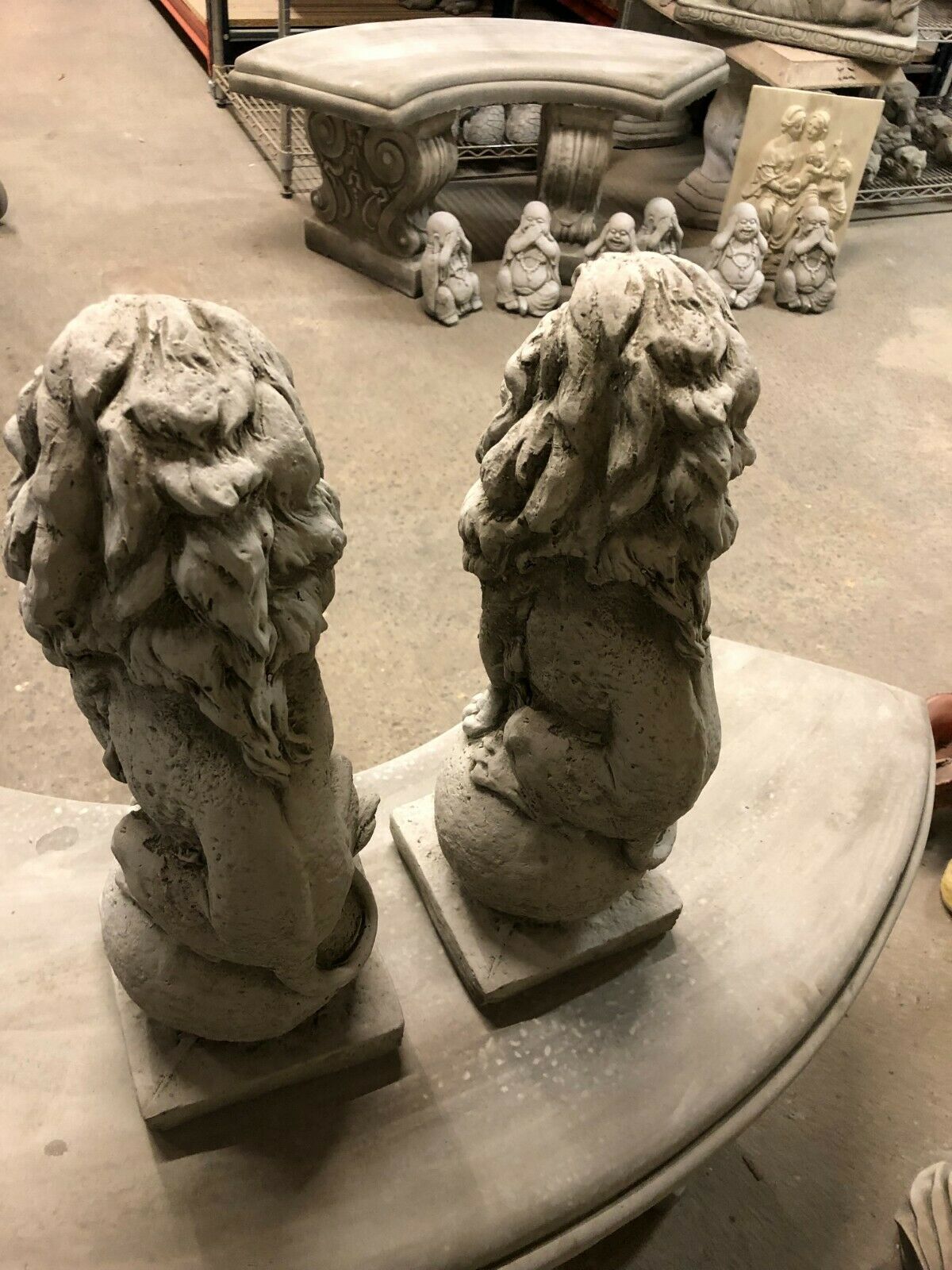 Rear view of stone lion statue pair, highlighting detailed craftsmanship and solid limestone build for long-lasting garden or patio decor.