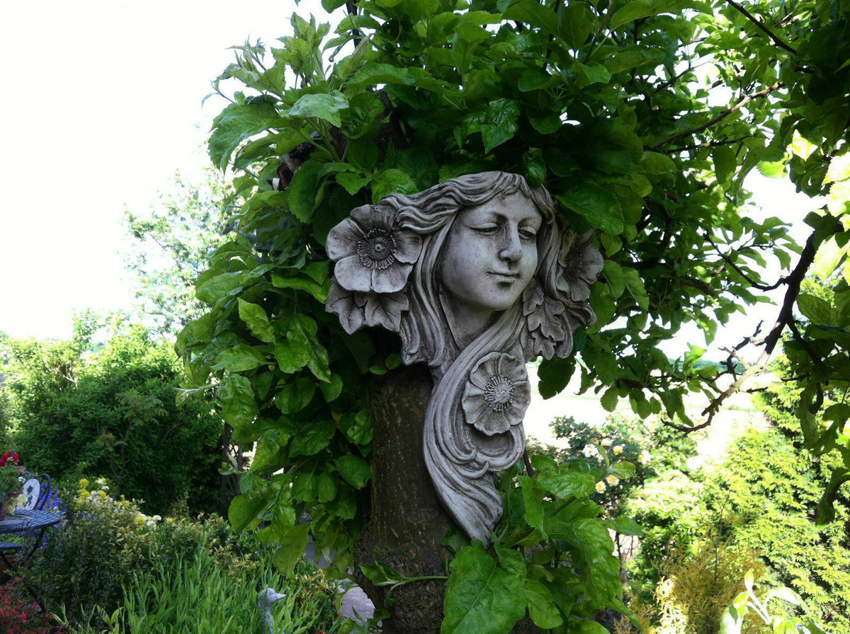 Elegant Art Nouveau Garden Plaque - Lady Wall Decor nestled in tree foliage, perfect for enhancing outdoor garden aesthetics with vintage charm.