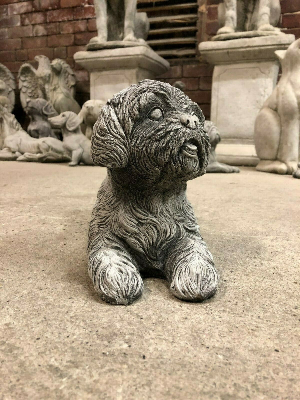 Front view of Antique Shih Tzu Stone Garden Ornament with expressive face. Enhances garden charm and withstands cold climates with durable build.