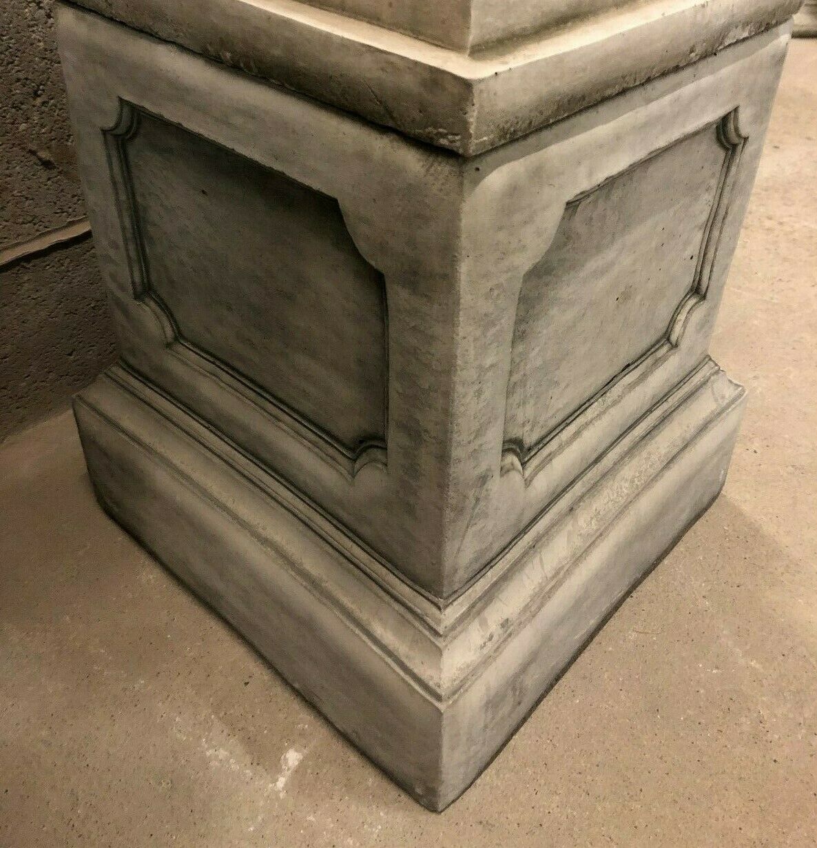 Base pedestal of Stone Laughing Buddha Statue, providing sturdy support and enhancing its presence in garden or indoor decor.