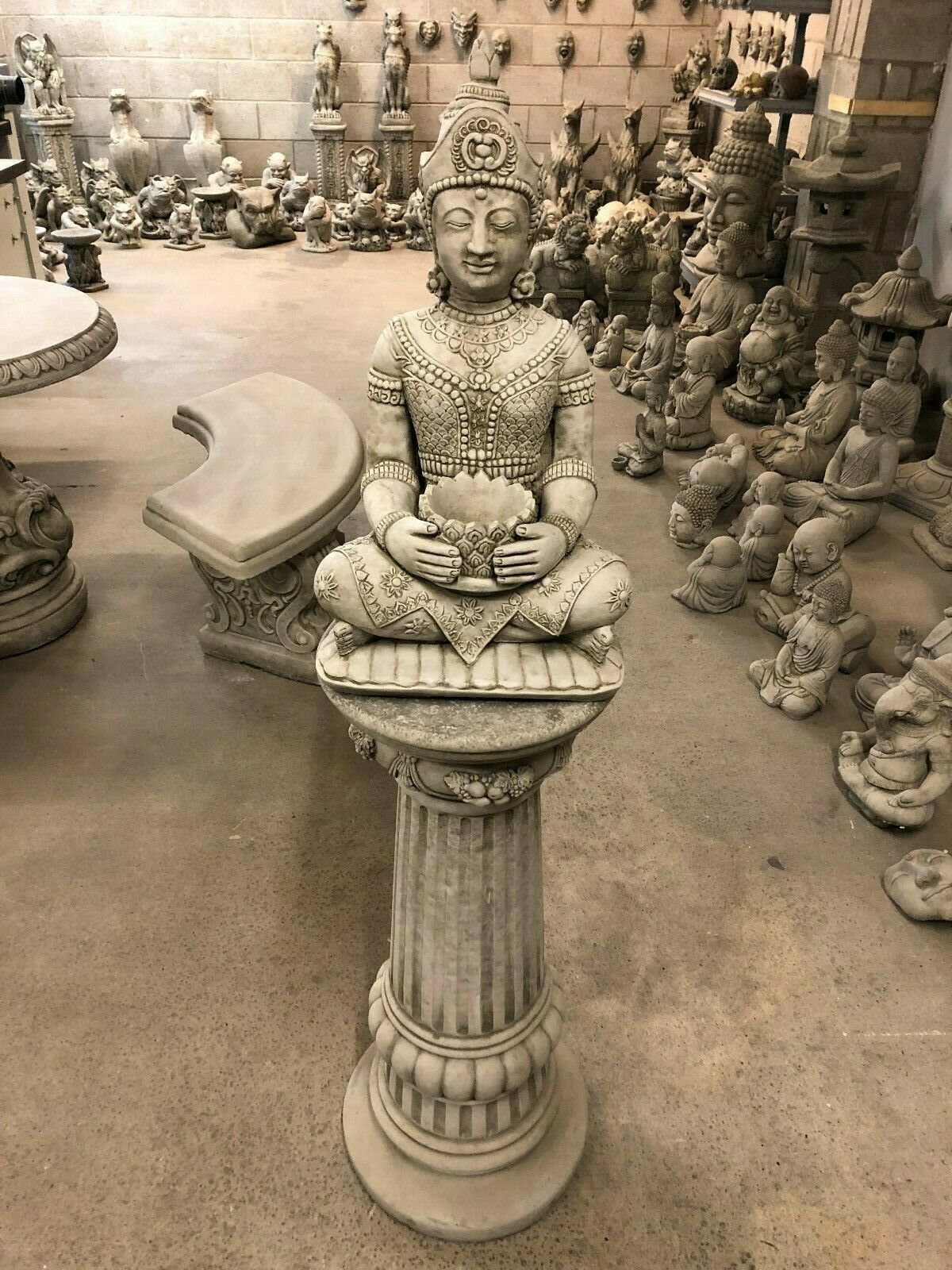 Full overhead view of the Stone Seated Buddha Statue on a tall plinth, designed for enhancing outdoor zen spaces.