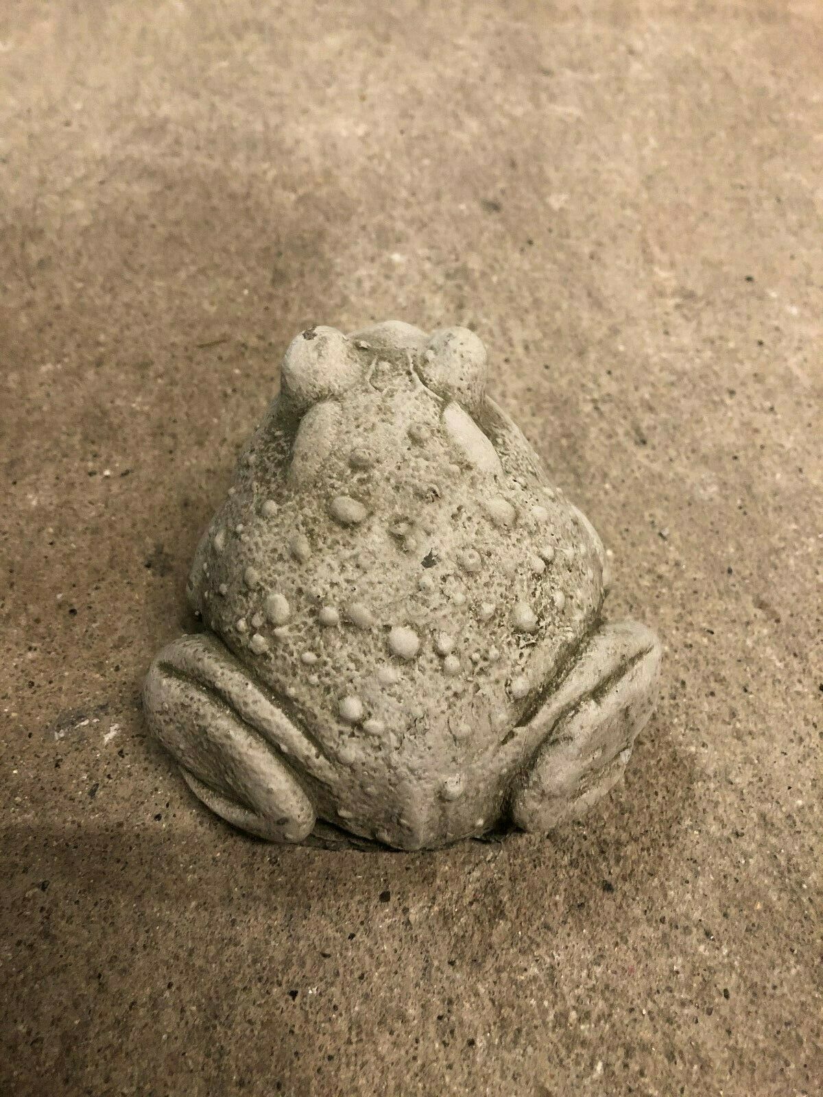 Top view of Stone Toad Ornament highlighting textured back and compact design, made from weather-resistant limestone for garden decoration.