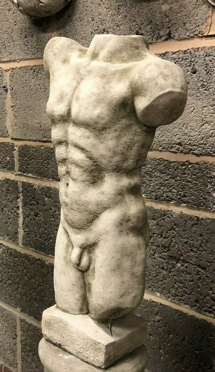 Angled view of Stone Male Torso Garden Ornament - Antique Grey Statue, highlighting sculpted abs and realistic stone texture for patio or garden use.