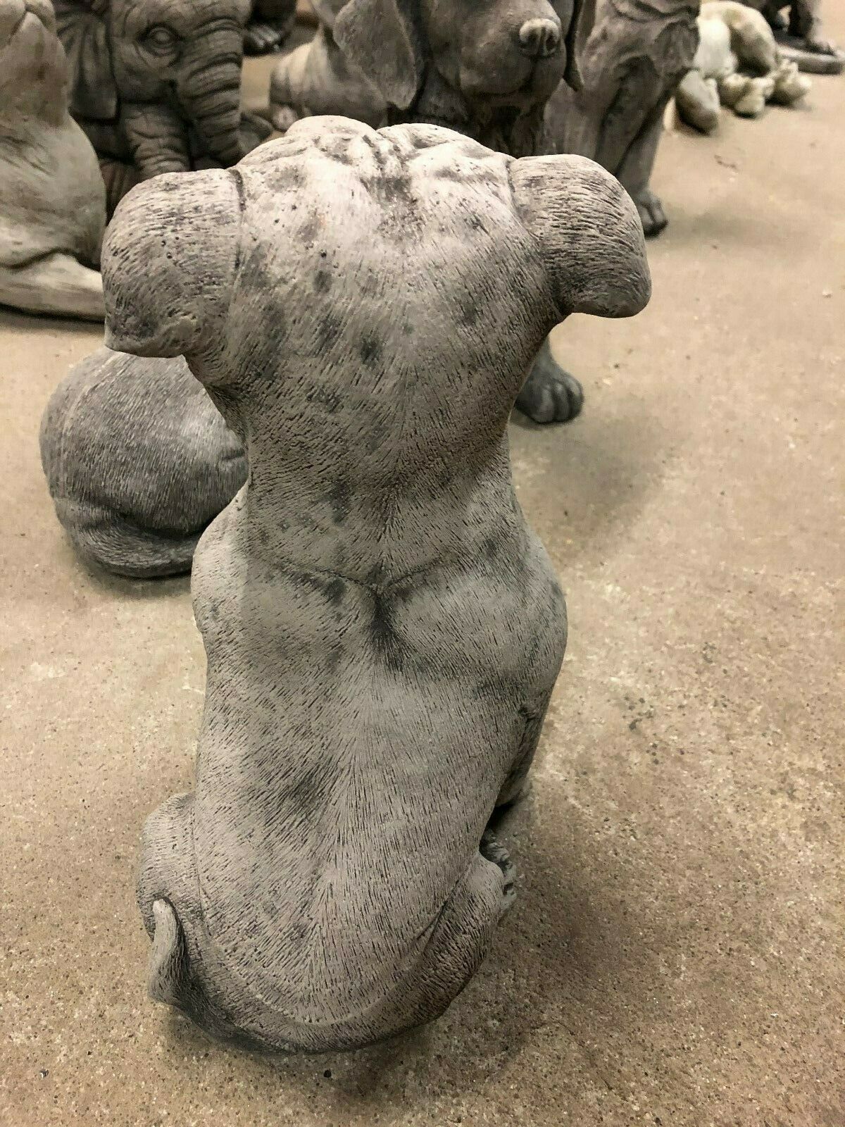 Staffordshire Bull Terrier Statue - Stone Garden Decor | UK Delivery. Rear view of detailed limestone dog statue, weather-resistant and decorative.