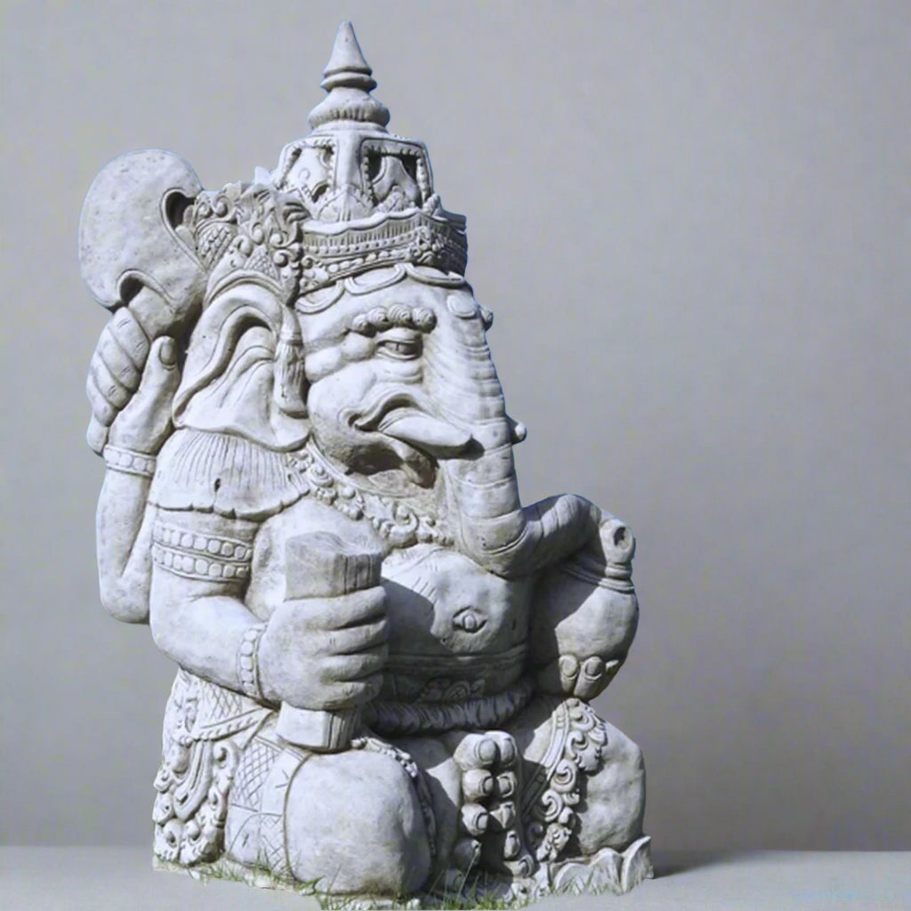 Side view of hand-carved large Ganesh statue in stone, showcasing divine symbolism and artistic craftsmanship for serene garden or meditation spaces.