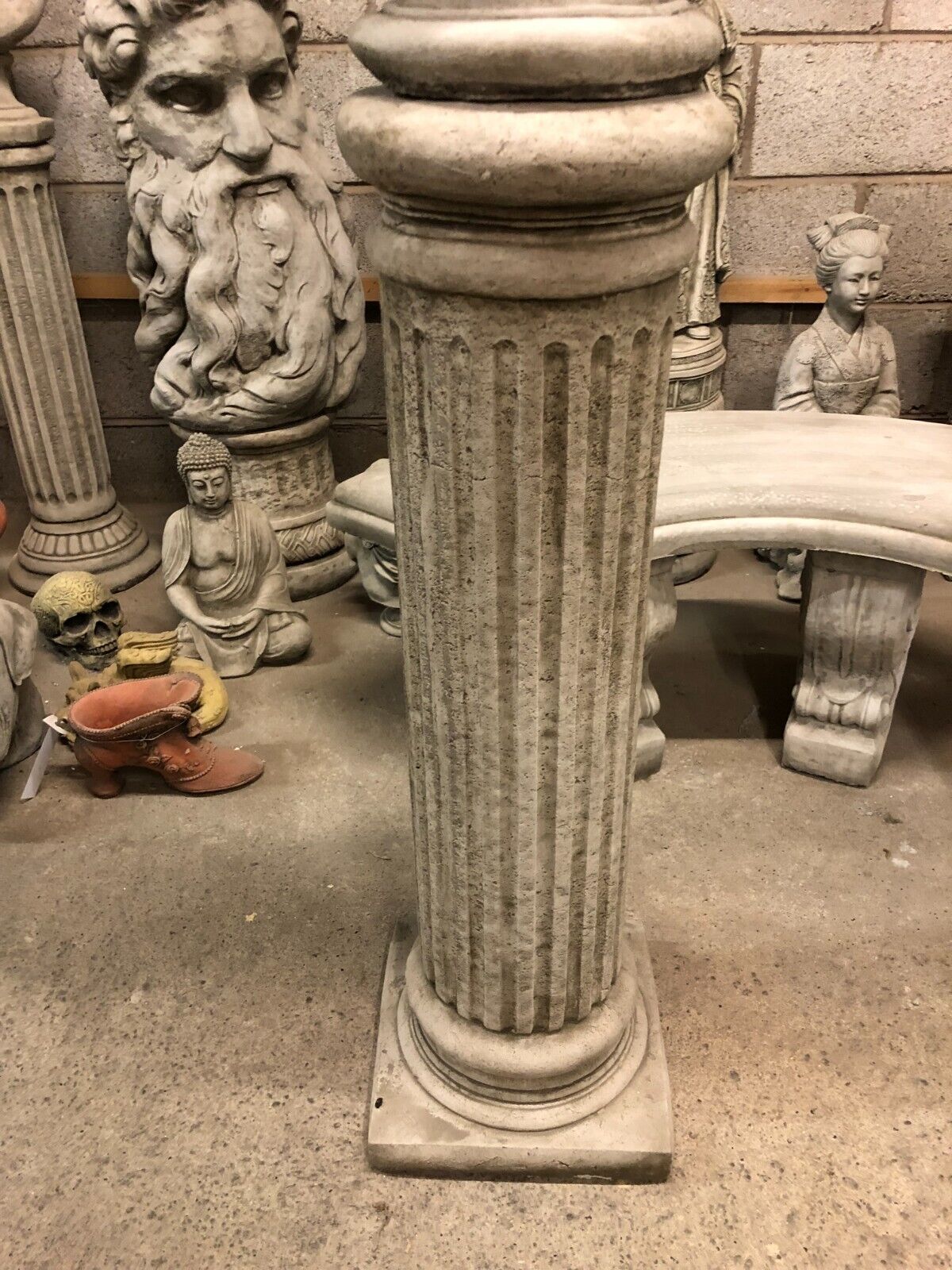 Close-up of column base with vertical grooves, part of the eagle garden statue set, ideal for traditional outdoor settings.