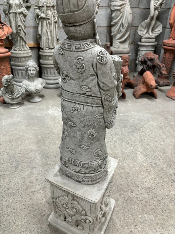 Rear view of the Stone God of Longevity statue showing robe patterns and plinth carvings, perfect for mythological garden sculpture themes.