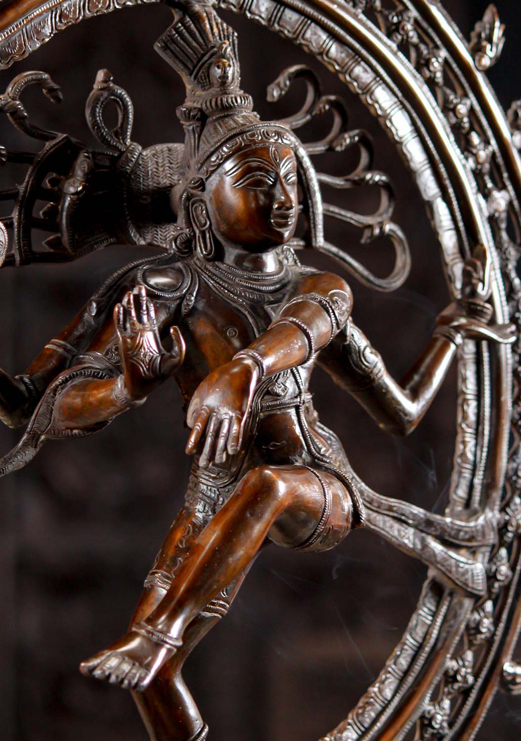 Angled view of Brass Dancing Shiva Statue - Cosmic Art | Timeless Symbol 27" showing dynamic pose and flowing adornments in fine brass work.