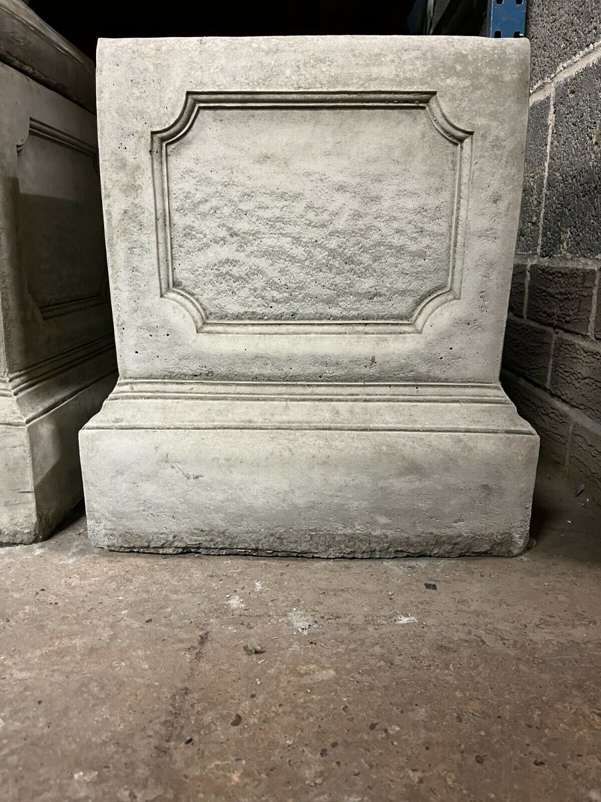 Heavy-duty stone garden plinth with classic square design and decorative molding, perfect for enhancing garden sculptures or ornaments.