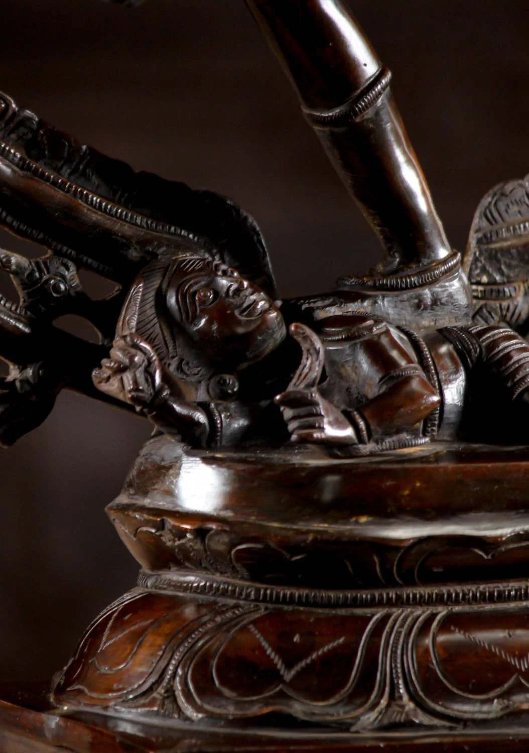Close-up of Apasmara underfoot in Brass Dancing Shiva Statue - Cosmic Art | Timeless Symbol 27", representing ignorance being conquered.