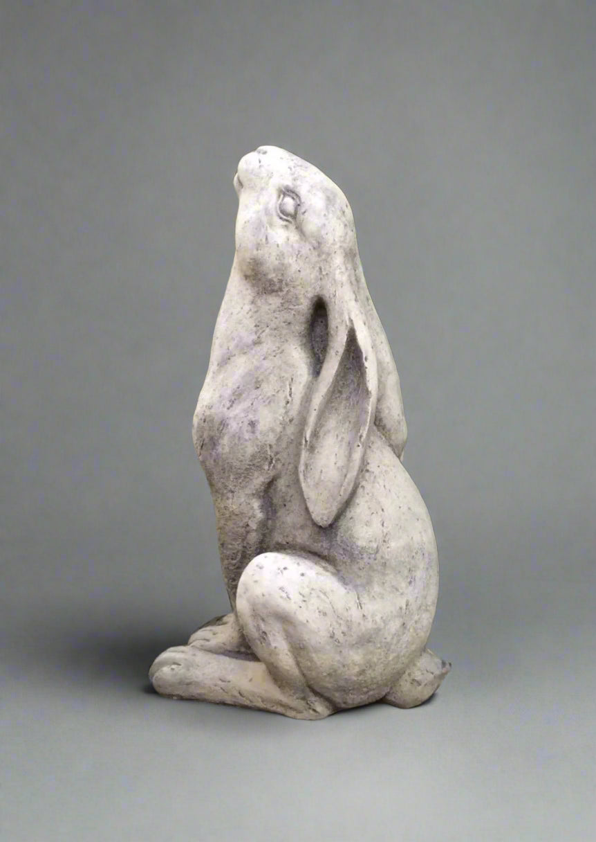 Stone Moongazing Hare Ornament in a seated pose with upward gaze, crafted from durable limestone for garden decor. Anti-crack 27cm sculpture adds charm.