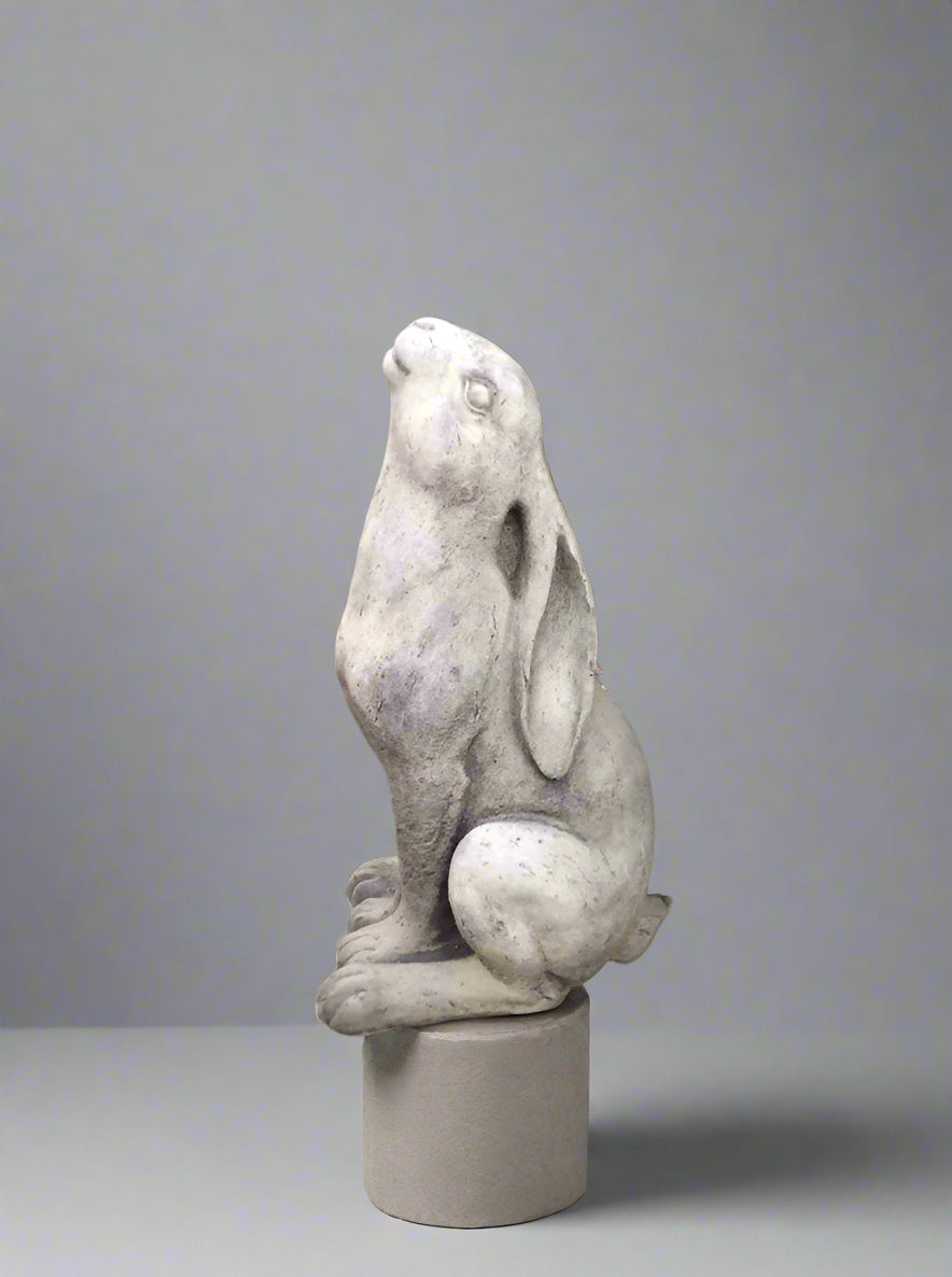 Whimsical Stone Moongazing Hare Garden Ornament on display stand, 27cm tall, made from weather-resistant limestone chippings for outdoor decoration.