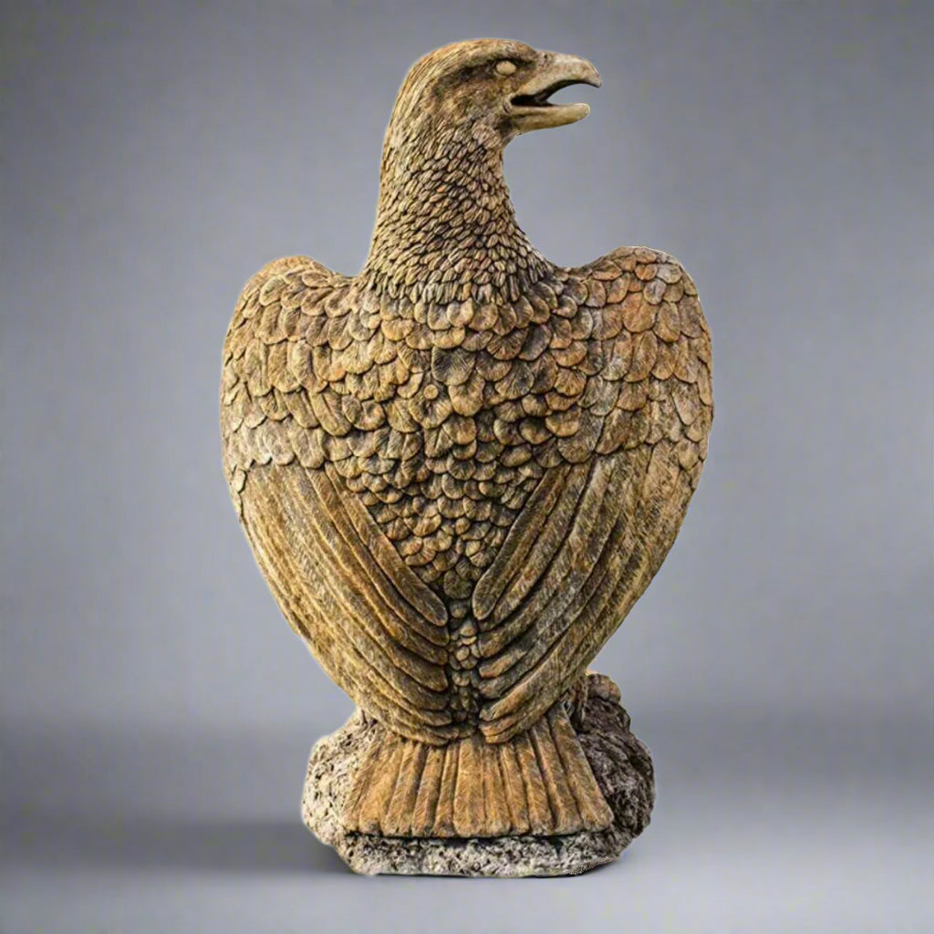 Rear view of XL Eagle Stone Statue showing intricate feather carving. Garden sculpture made from weather-resistant stone for lasting elegance.