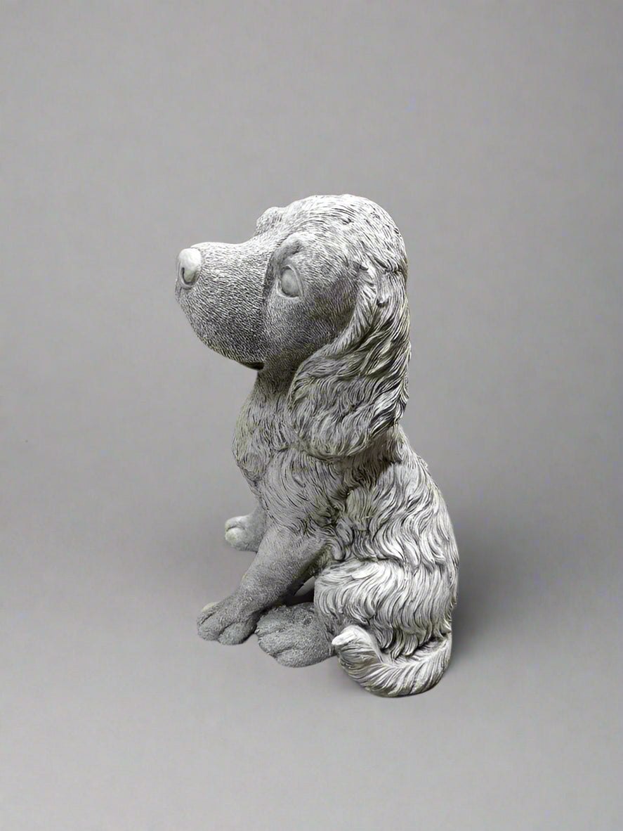 Side view of Stone Spaniel Dog Statue showcasing detailed craftsmanship and durable limestone material for garden ornament use.