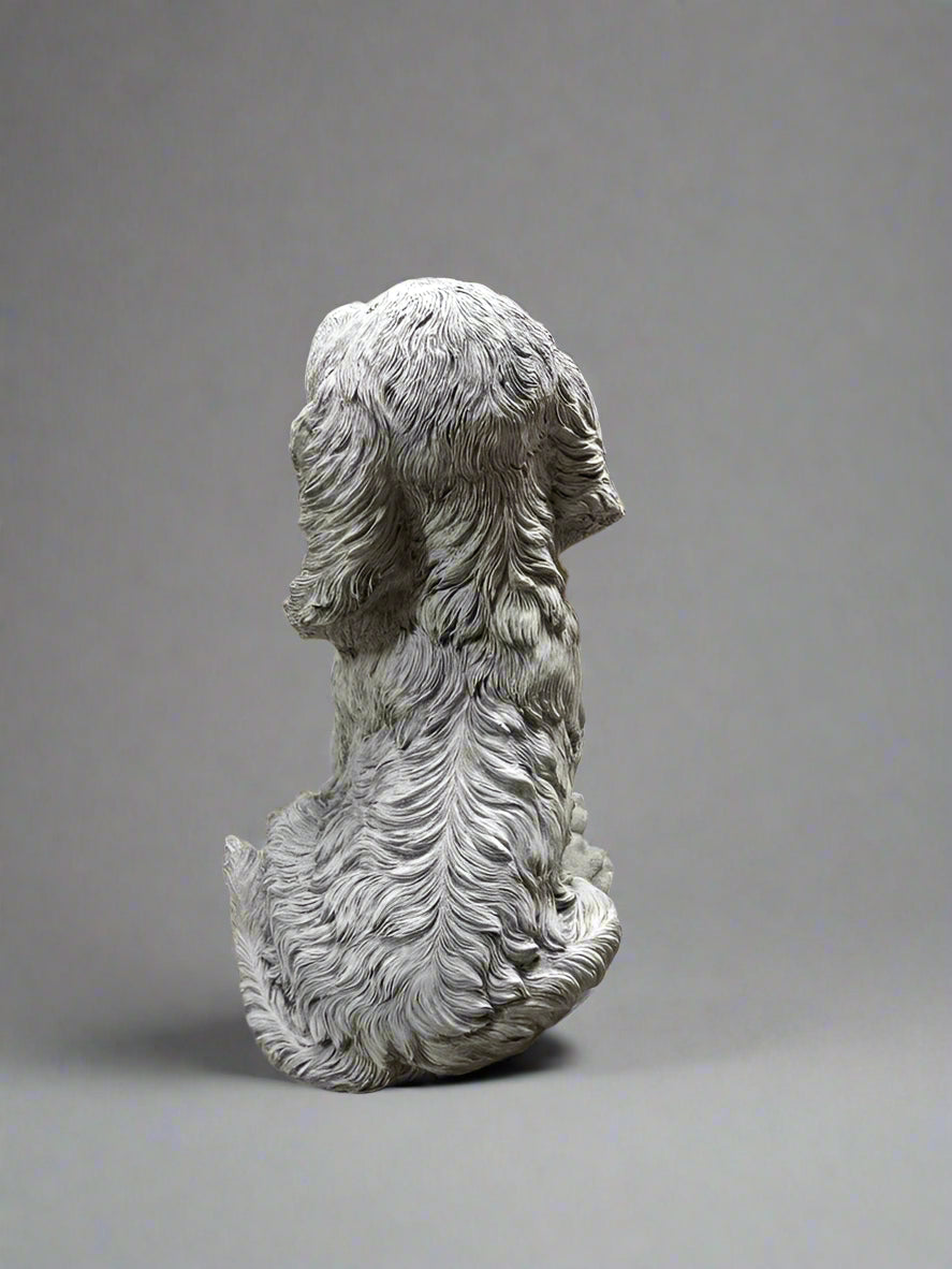 Rear view of Stone Spaniel Dog Statue highlighting intricate fur detailing, ideal for enhancing outdoor garden aesthetics.
