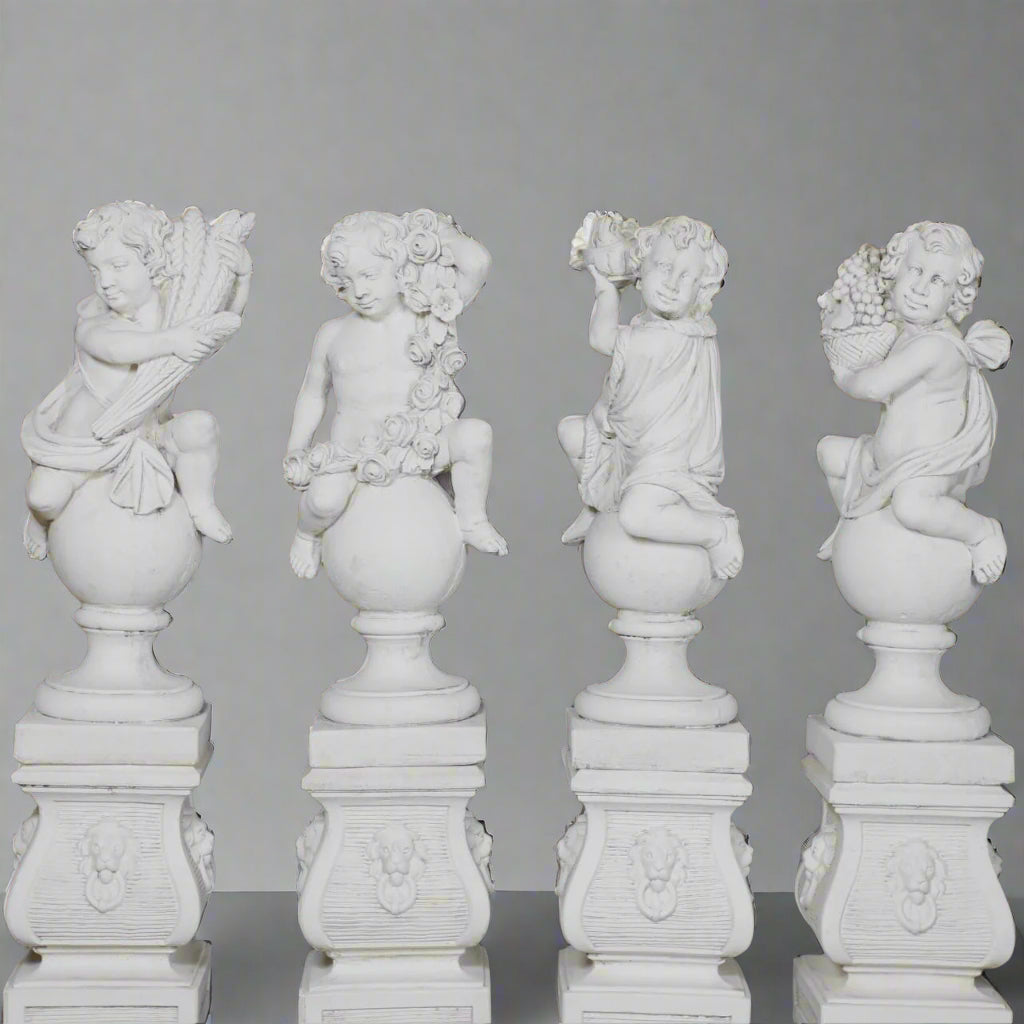 Hand-Carved Four Seasons Cherub Statues in stone, ideal for garden sculptures, showcasing seasonal motifs with floral, fruit, and harvest details.