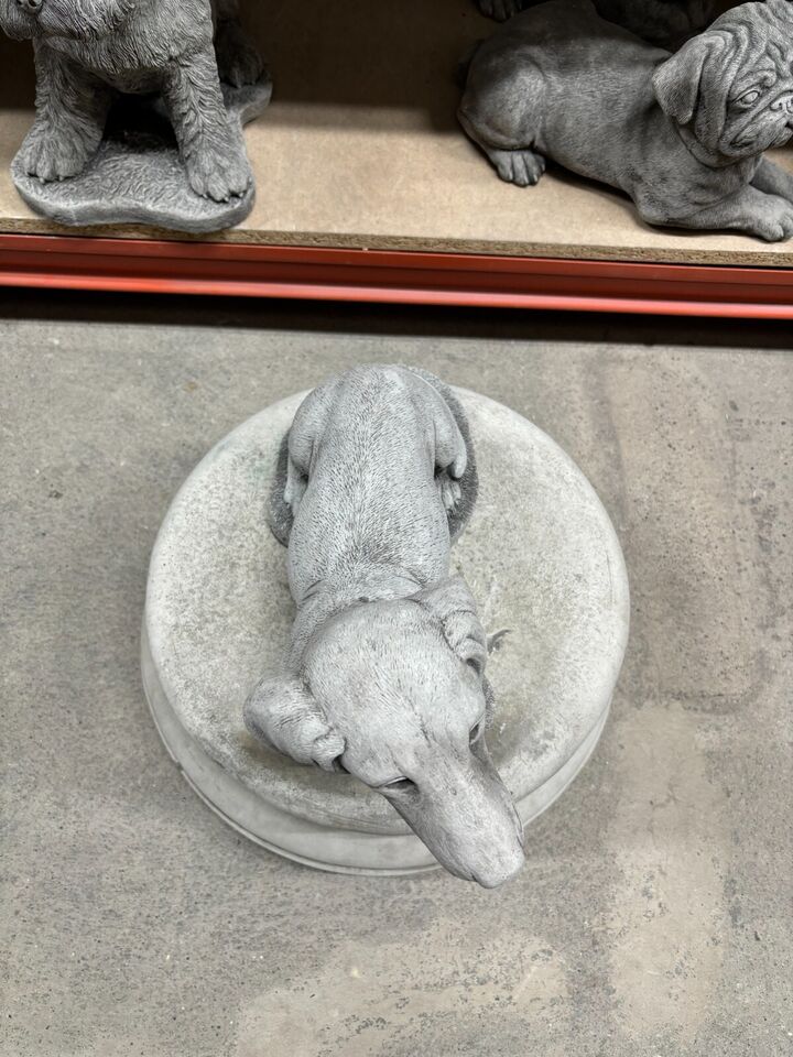 Top-down view of Stone Sausage Dog Garden Ornament showing detailed craftsmanship. Great for patios, lawns, or memorial garden setups.