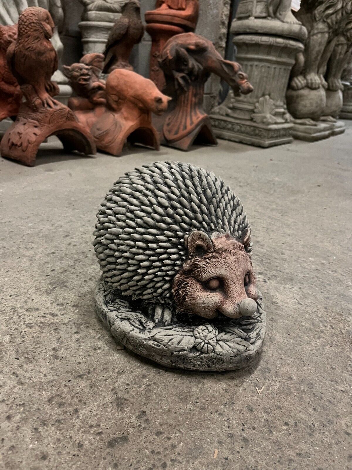 Detailed Stone Garden Hedgehog Ornament featuring realistic spines and a curled pose. Perfect for enhancing garden character and charm.