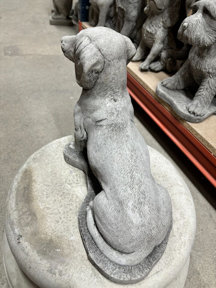 Rear view of weatherproof Stone Sausage Dog Garden Ornament. Durable and decorative, perfect for home garden sculpture collections.