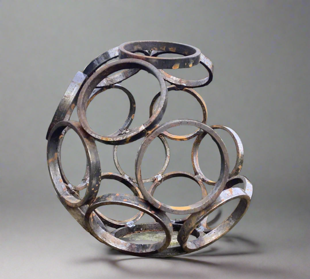 Small Steel Garden Sculpture - Modern Art, Durable | 11" featuring interlocking metal rings in a spherical shape. Ideal for outdoor garden decor.