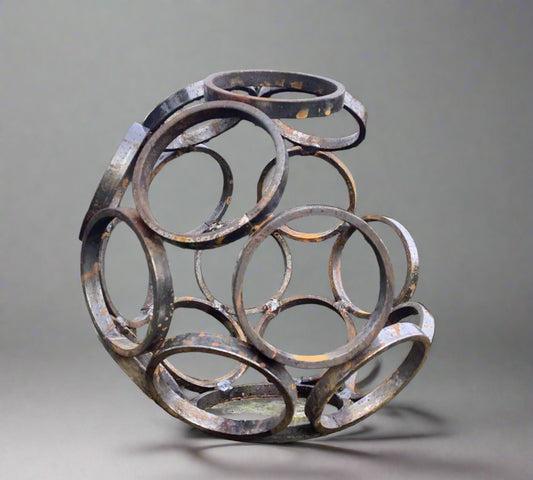 Small Steel Garden Sculpture - Modern Art, Durable | 11" featuring interlocking metal rings in a spherical shape. Ideal for outdoor garden decor.