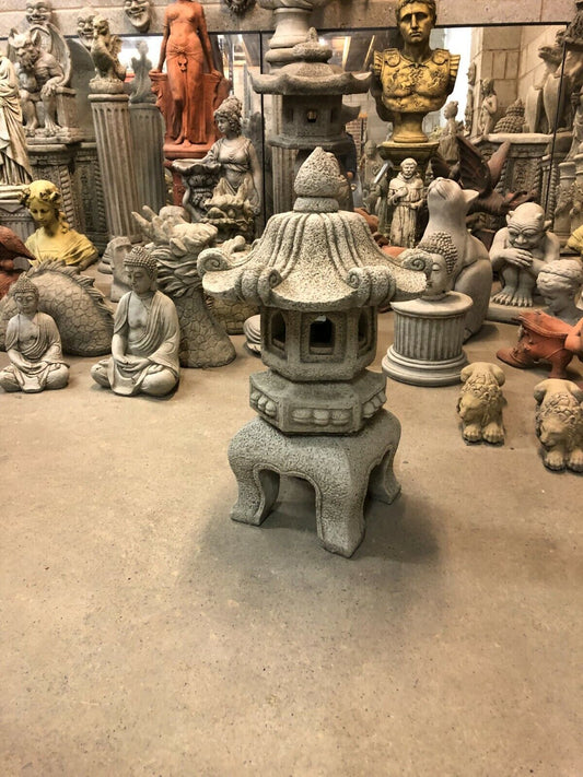 Stone Pagoda Garden Lantern with antique finish, 66cm tall, ideal for elegant outdoor garden decor and durable in cold climates.