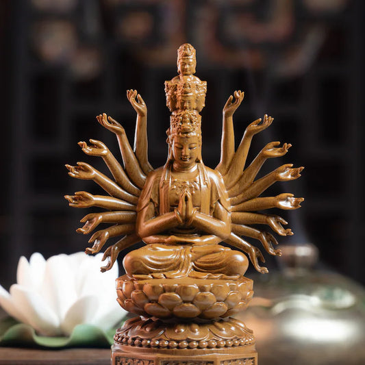 Wooden Guan Yin Meditation Statue with multiple arms, seated on lotus base. Hand-carved decor for spiritual harmony in home or garden.