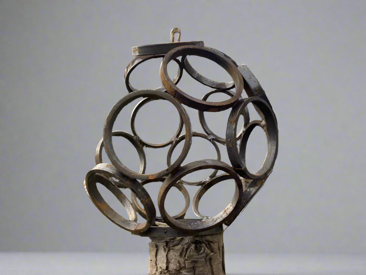 11-inch Small Steel Garden Sculpture with abstract circular metal frame. Modern art piece perfect for home or garden decoration.
