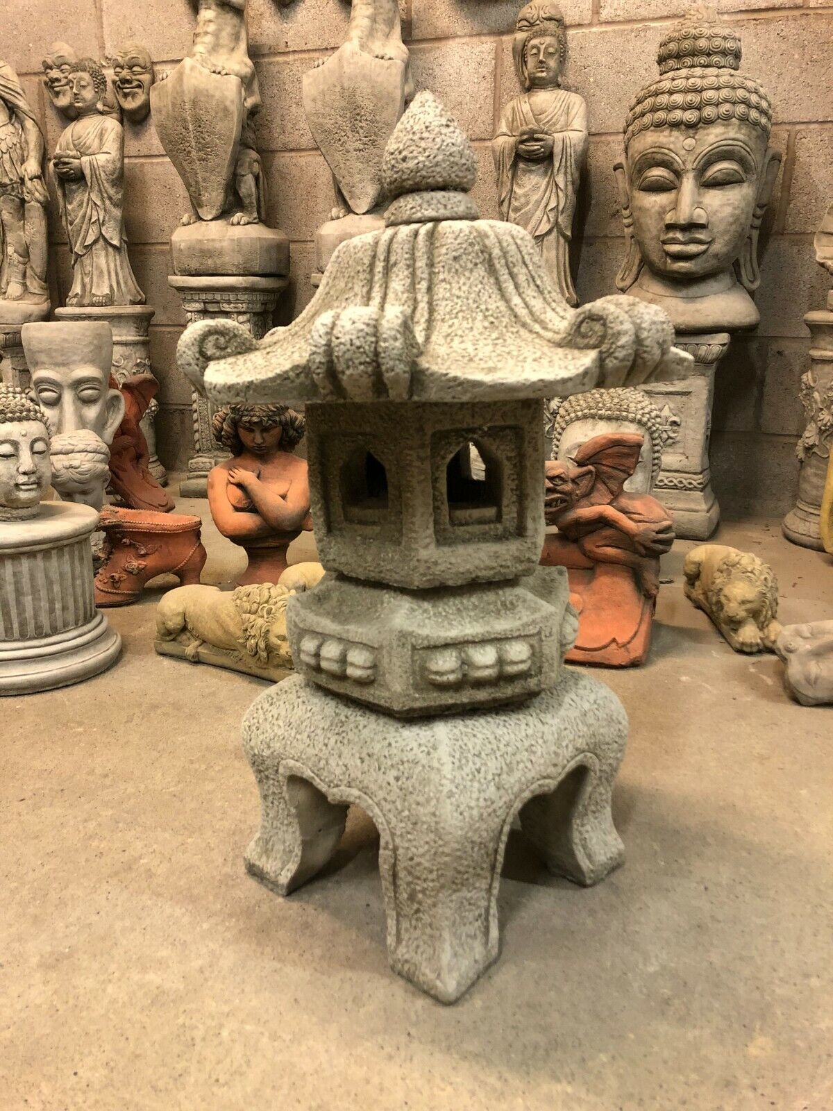Asian-style Stone Pagoda Lantern sculpture for garden ornamentation, crafted from limestone with intricate detailing and weather resistance.
