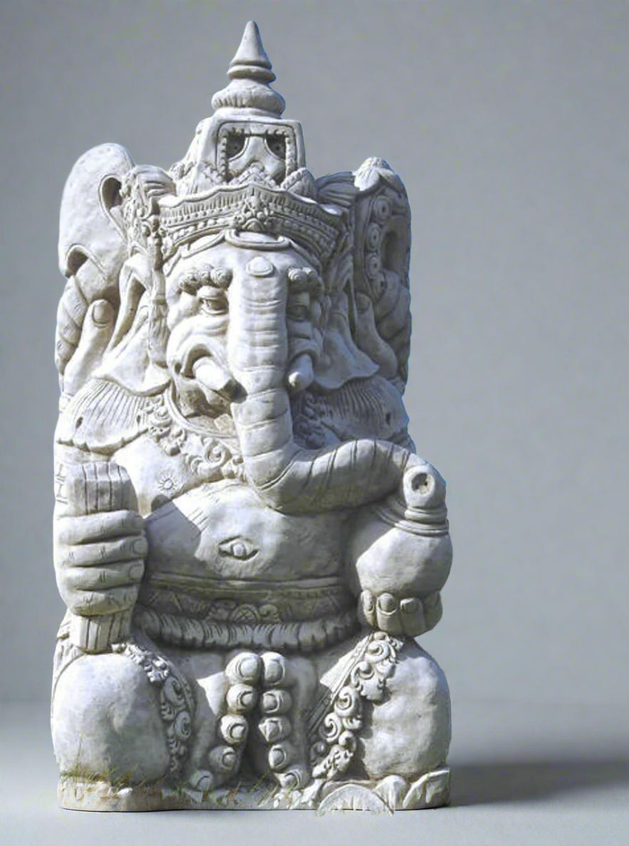 Large stone Ganesh statue hand-carved with intricate detailing, seated in a meditative pose for garden or indoor decor. Symbol of wisdom and protection.