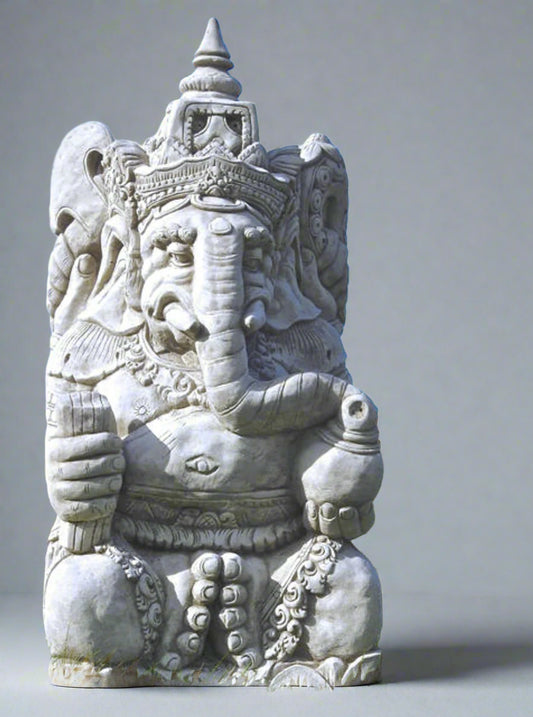 Large stone Ganesh statue hand-carved with intricate detailing, seated in a meditative pose for garden or indoor decor. Symbol of wisdom and protection.