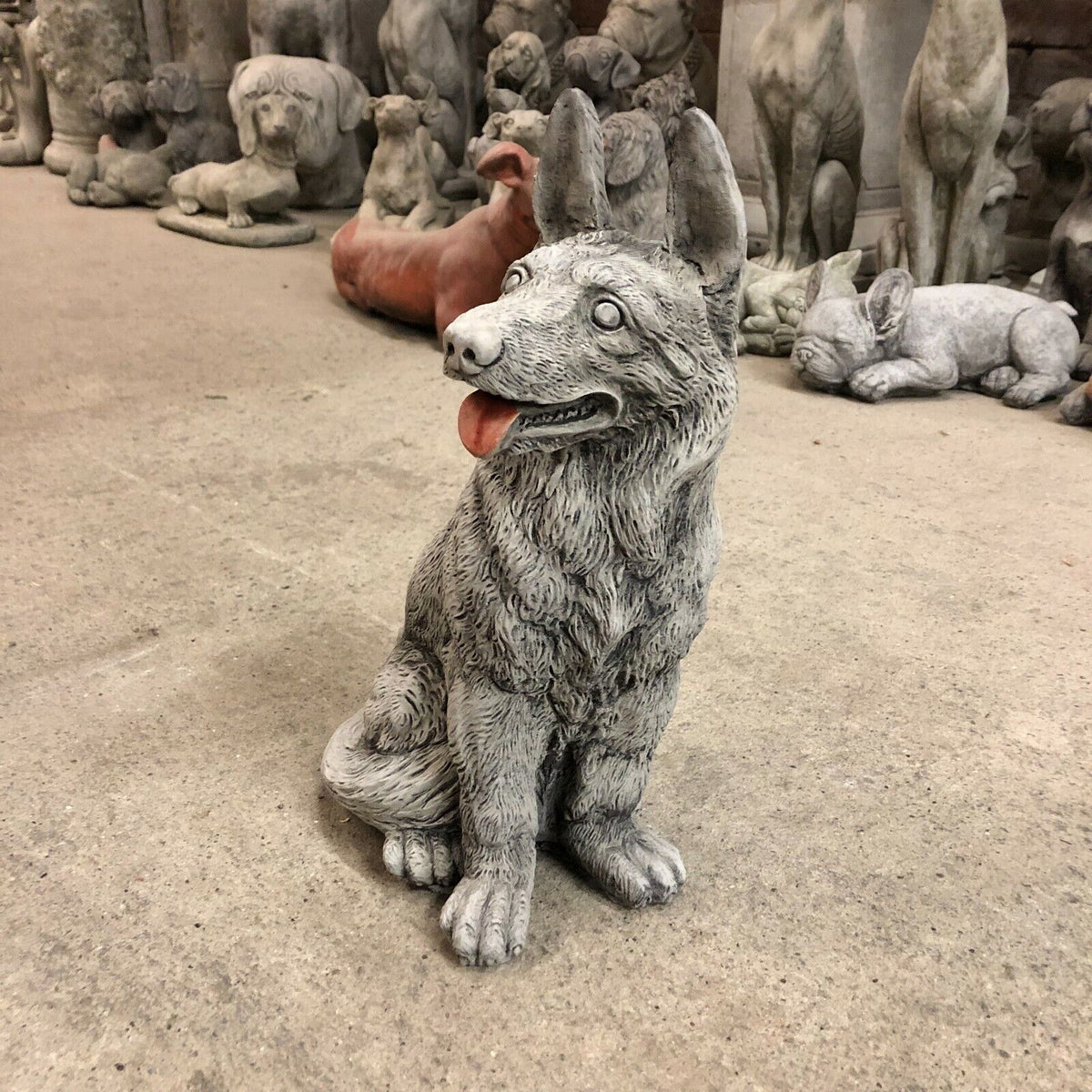 Side angle of weatherproof Alsatian Dog Stone Statue, showcasing realistic fur detail and expressive face for lawn or patio decoration.