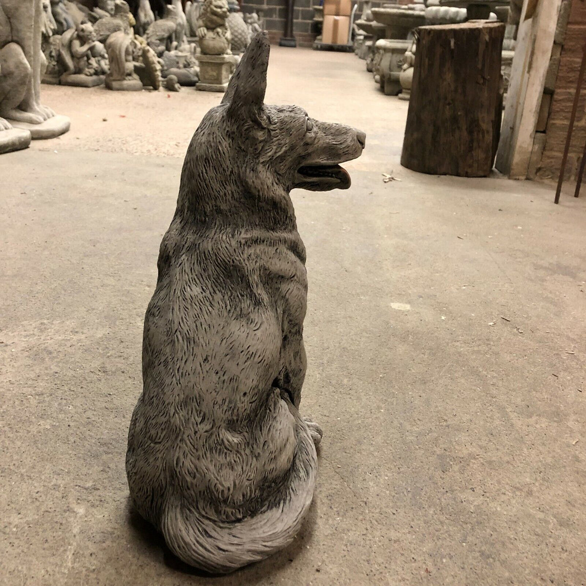 Angled rear view of Alsatian Dog Stone Statue, ideal for patios or gardens, crafted in durable limestone with realistic detailing.
