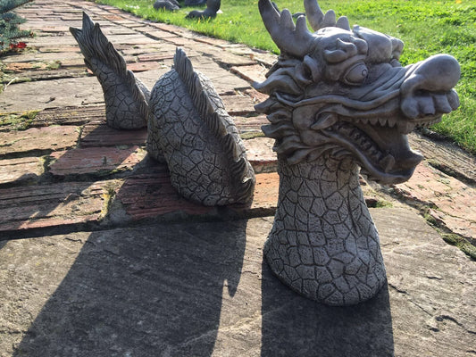 Chinese Dragon Stone Ornament - Antique Garden Decor featuring a segmented limestone dragon sculpture with detailed scales and fierce expression.