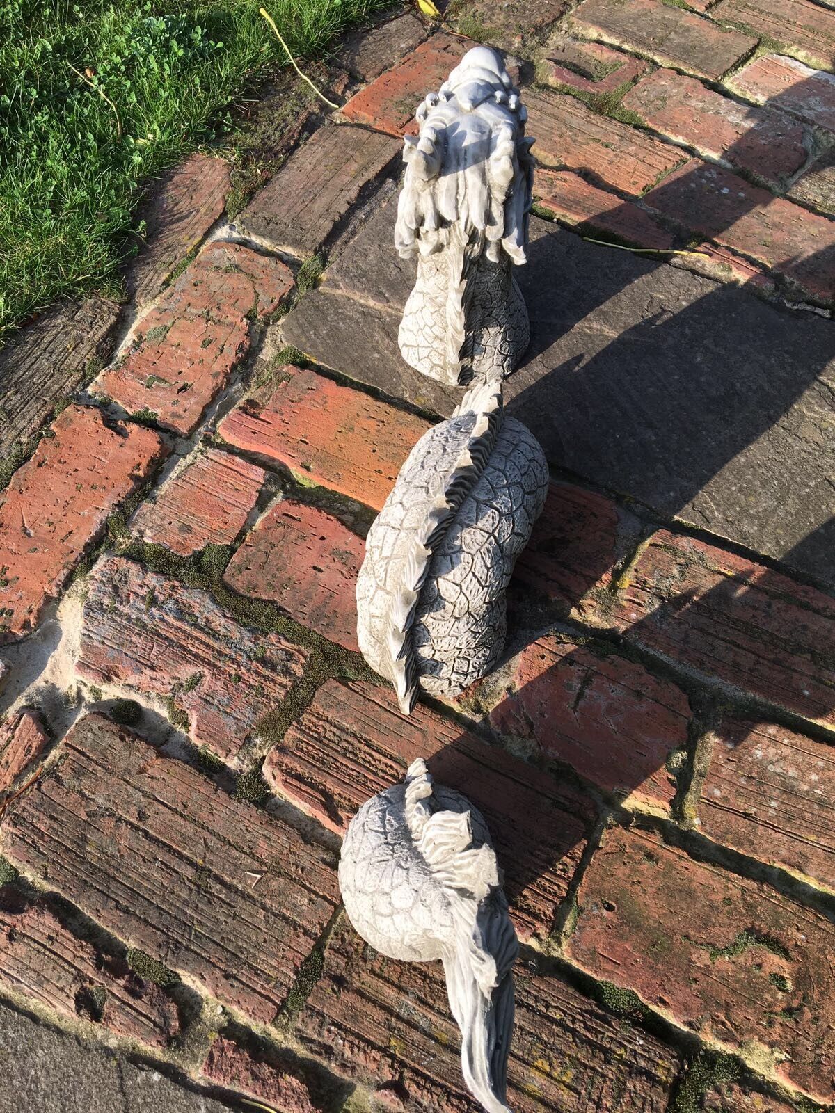 Segmented Stone Chinese Dragon Ornament viewed from above, showcasing antique finish and textured scales for unique garden sculpture appeal.
