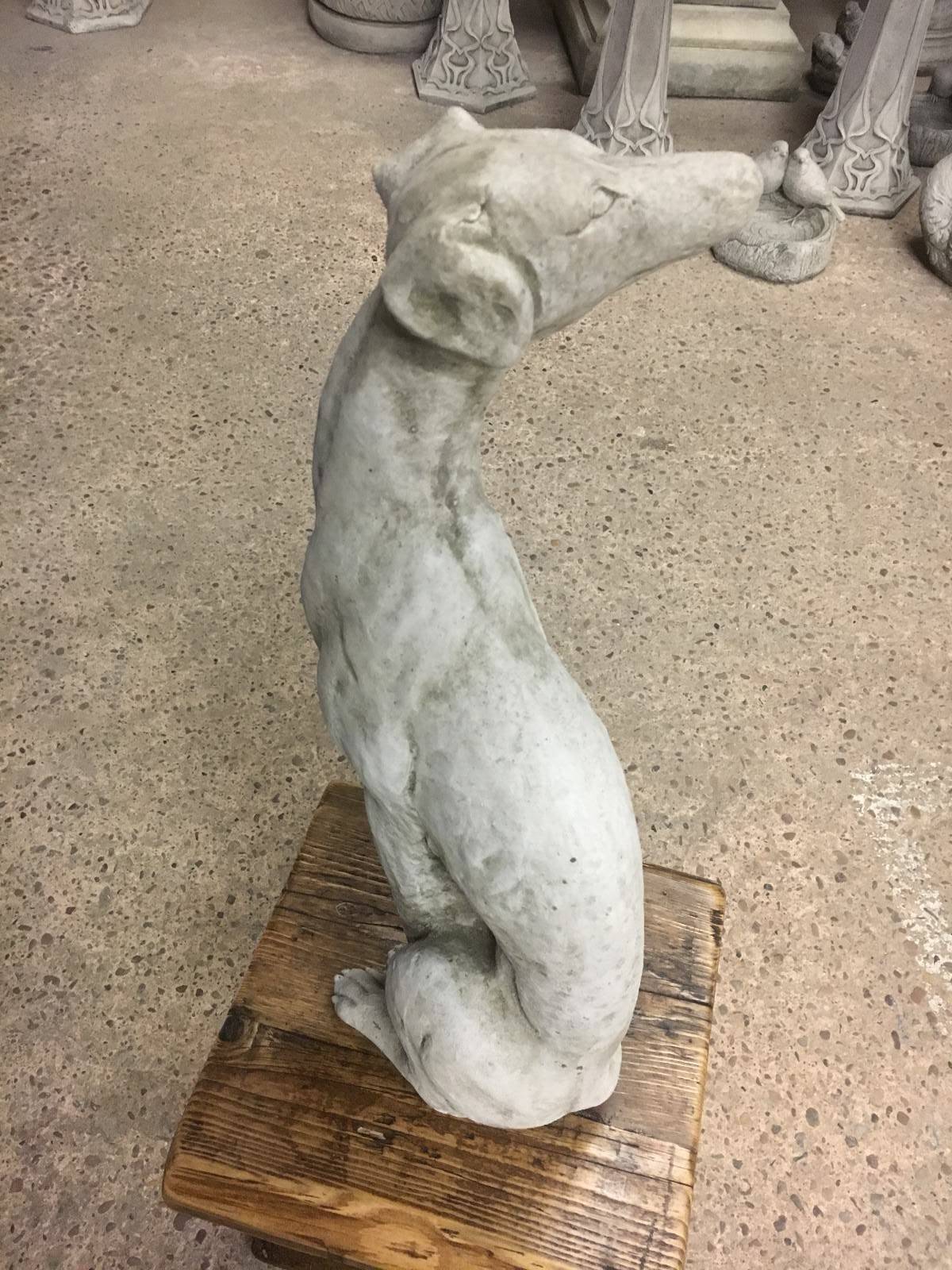 Side view of a greyhound garden statue showing muscular detail and elegant posture, perfect for enhancing garden charm.