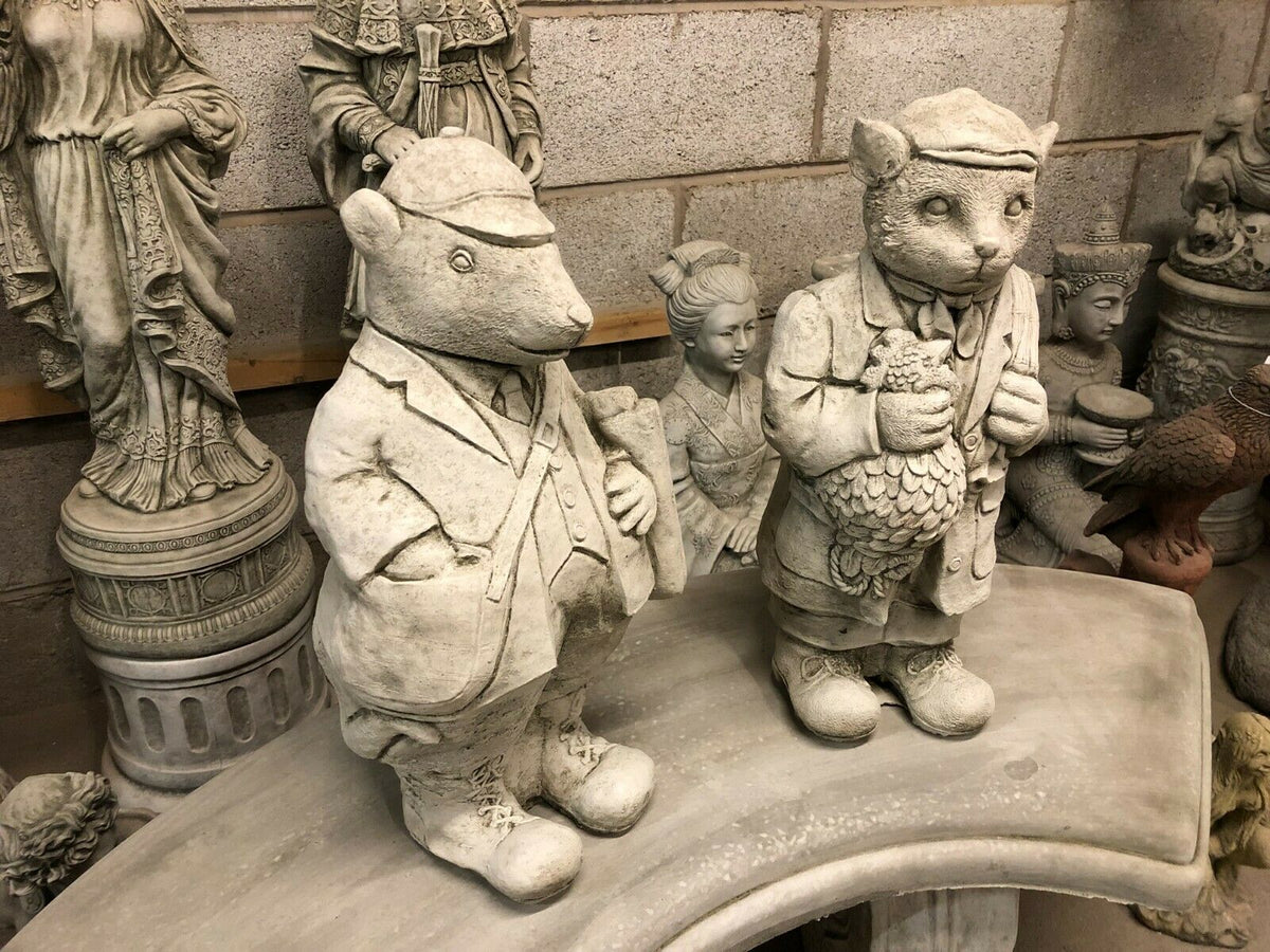 Stone Gamekeeper & Poacher Statues-Garden Decor | Solid & Durable. Two whimsical animal figures in traditional outfits, perfect for garden character.