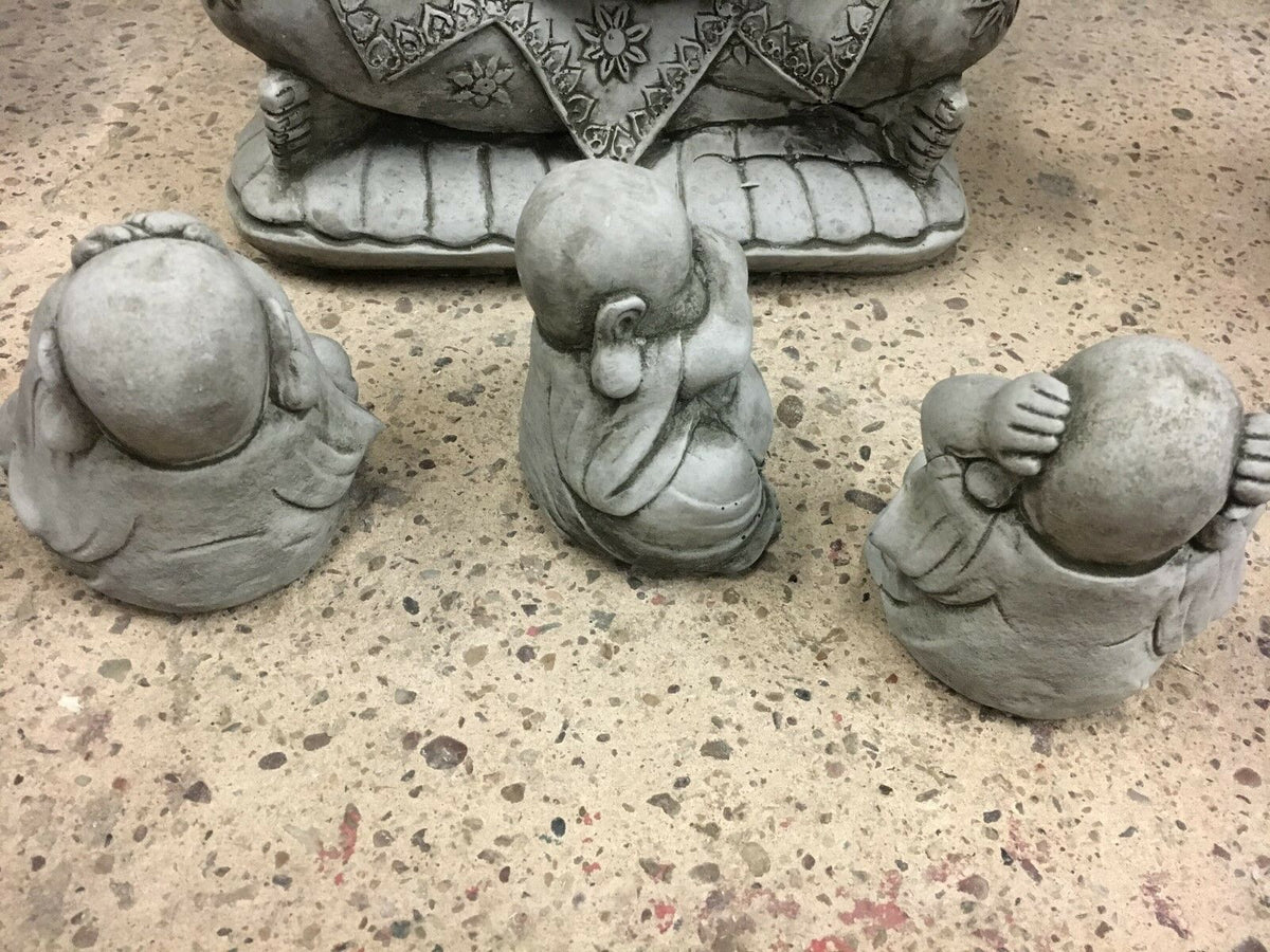 Rear view of Hear, See & Speak No Evil stone Buddha ornaments showing sculpted detail and craftsmanship for garden display.