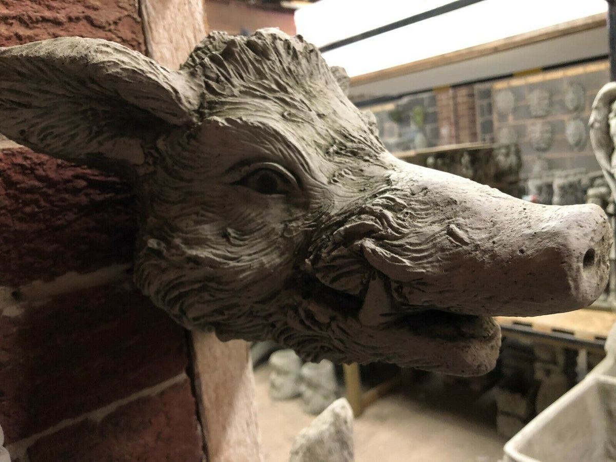 Detailed close-up of the Wild Boar Wall Plaque’s face with textured fur and tusks. Durable rustic stone ornament for garden walls.