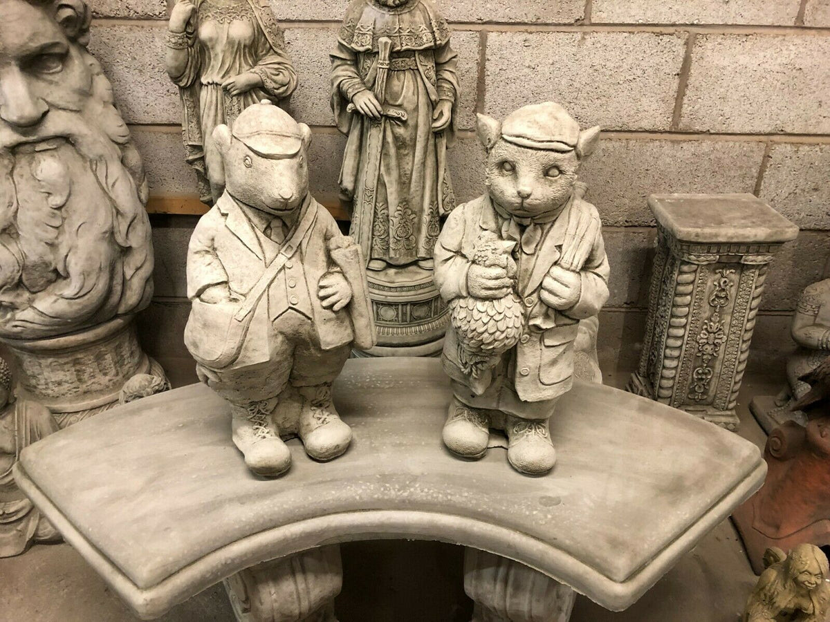 Stone Gamekeeper & Poacher Statues-Garden Decor | Solid & Durable. Set of two animal characters on a stone bench, enhancing garden sculpture collections.