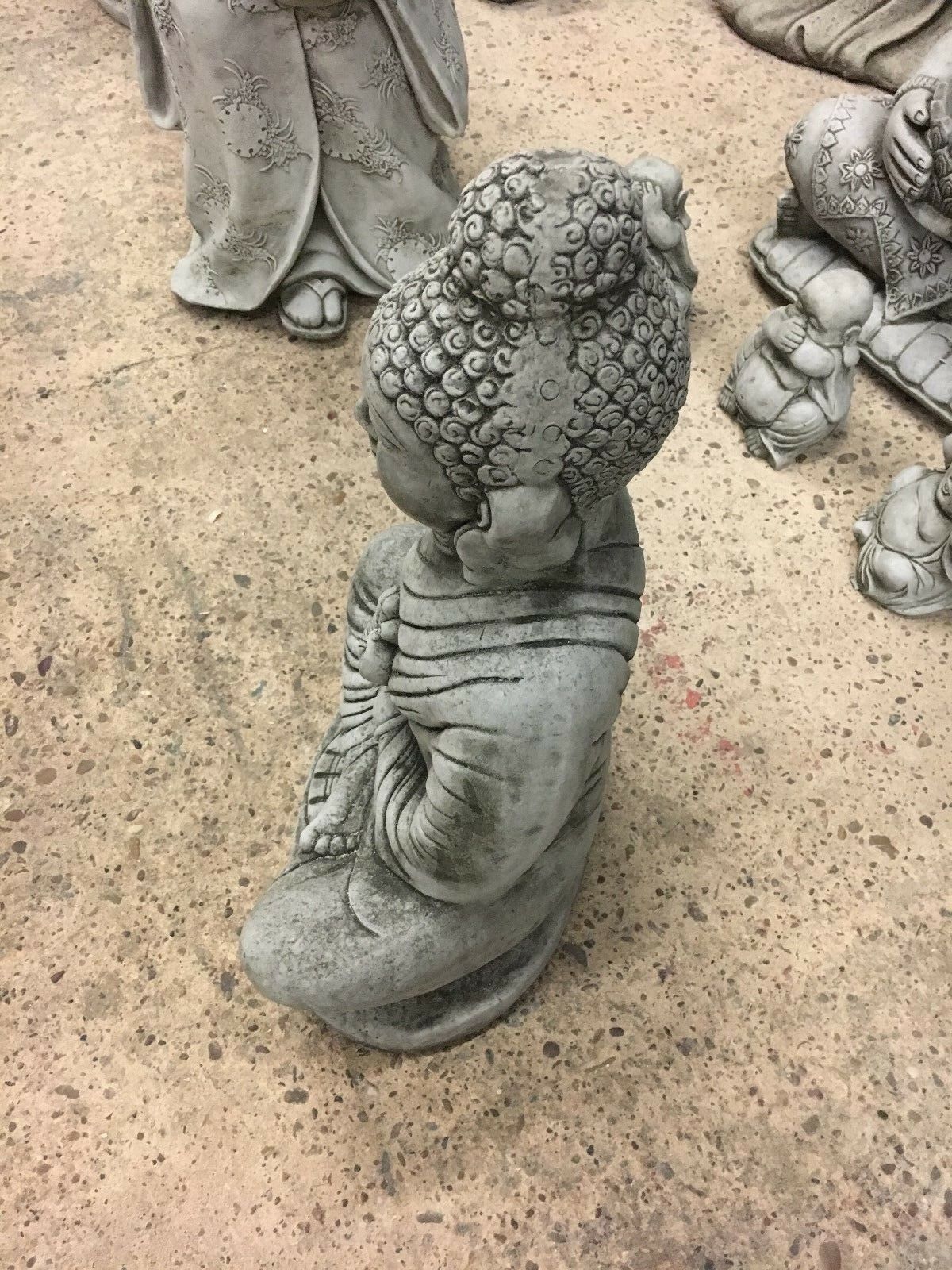 Side profile of Weather-Proof Buddha Statue in Jnana Mudra, showing detailed craftsmanship and solid stone construction for garden use.