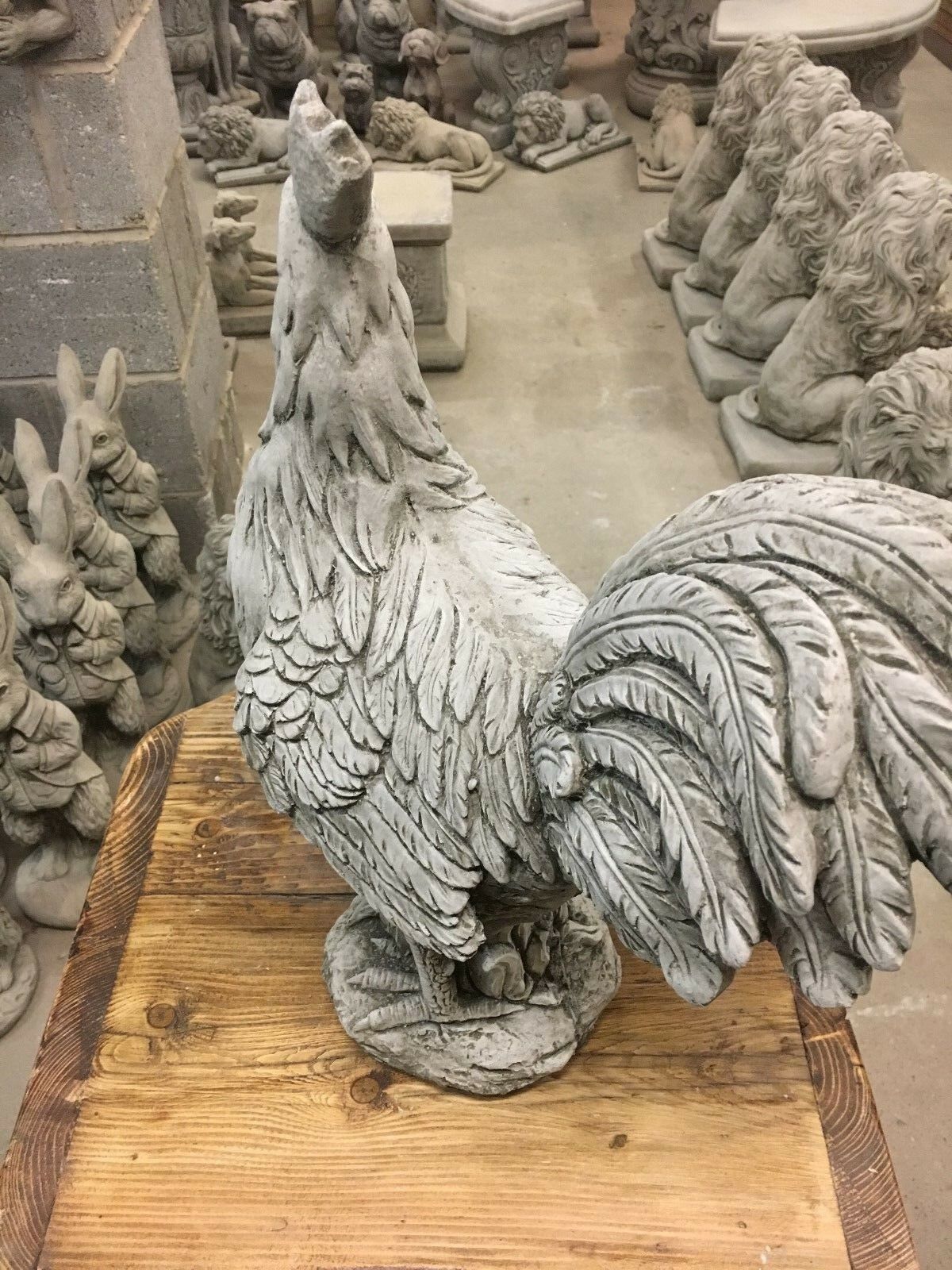 Rear view of Stone Rooster Garden Ornament showing intricate feather carvings, suitable for rustic garden or porch decoration.