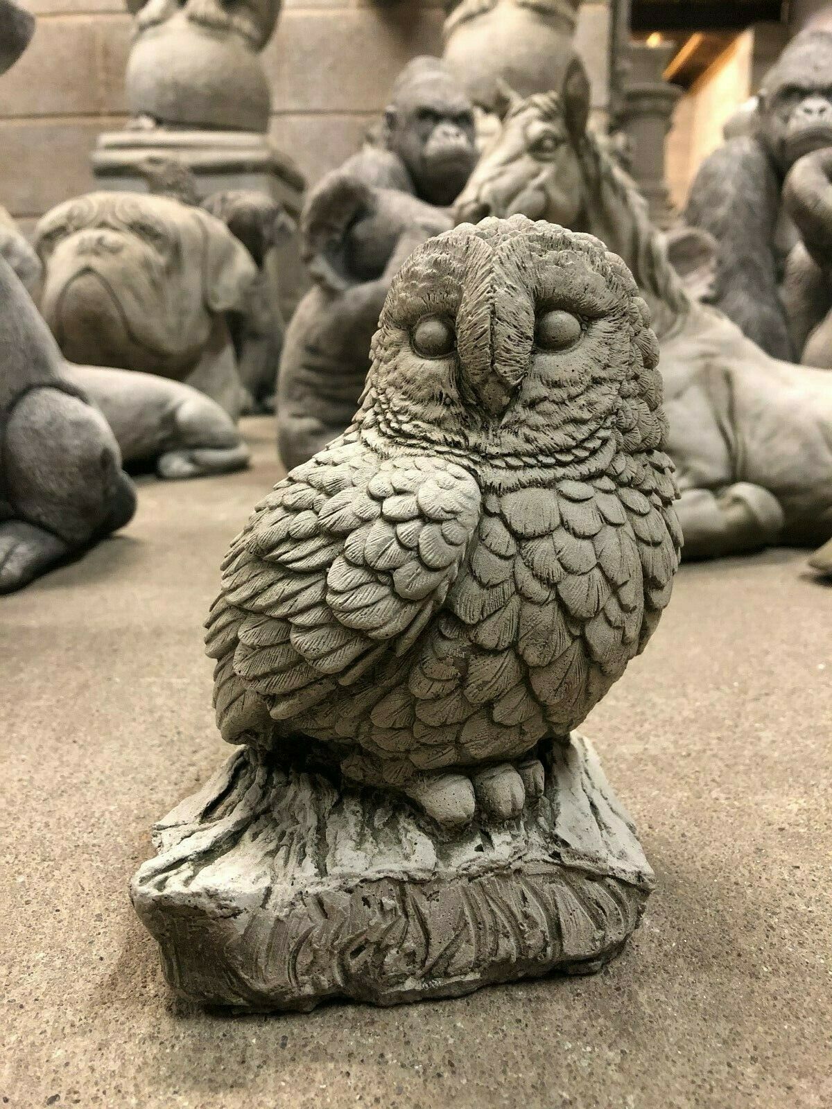 Stone Owl on Log Ornament with detailed feathers and limestone finish, ideal for garden decor and outdoor wildlife-themed displays.