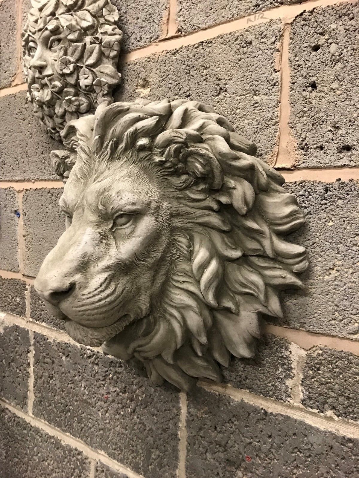 Side view of Stone King Lion Wall Plaque showing intricate mane texture and solid stone craftsmanship for outdoor garden decoration.